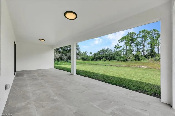 View of patio / terrace with view of wooded area
