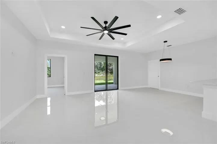 Spare room with ceiling fan, recessed lighting, and light tile patterned flooring