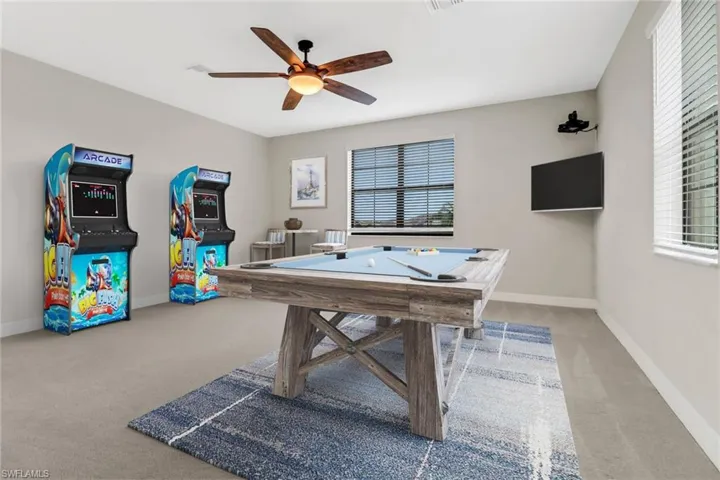 virtually staged game room in upstairs bedroom (bedroom 1 upstairs)