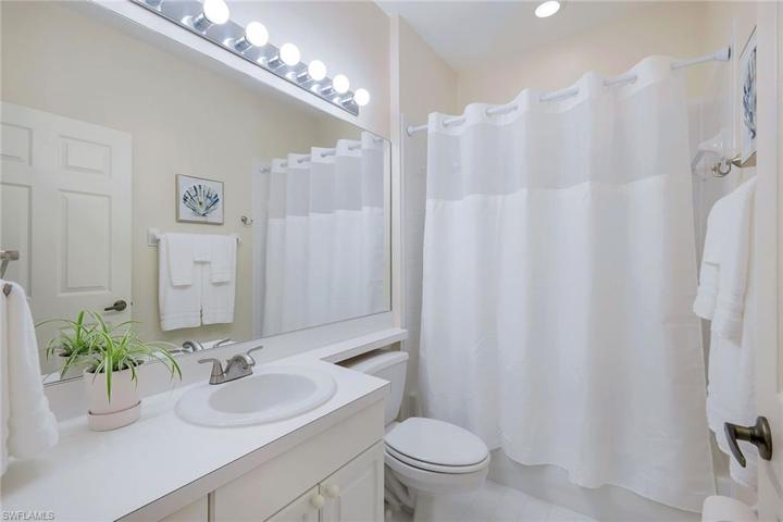 Guest bath is in a hall with pocketing door - making an ensuite guest bedroom & bath!