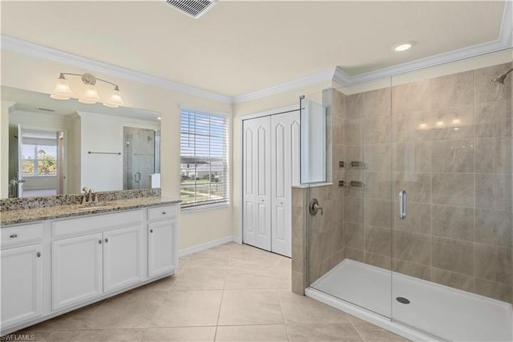 spacious primary bath with frameless shower