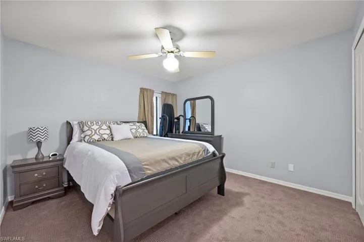 Bedroom with carpet and ceiling fan