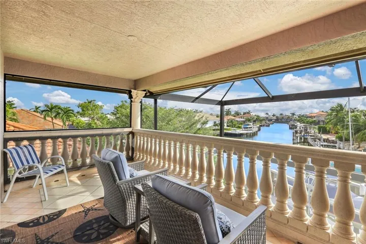 Wooden terrace featuring a water view
