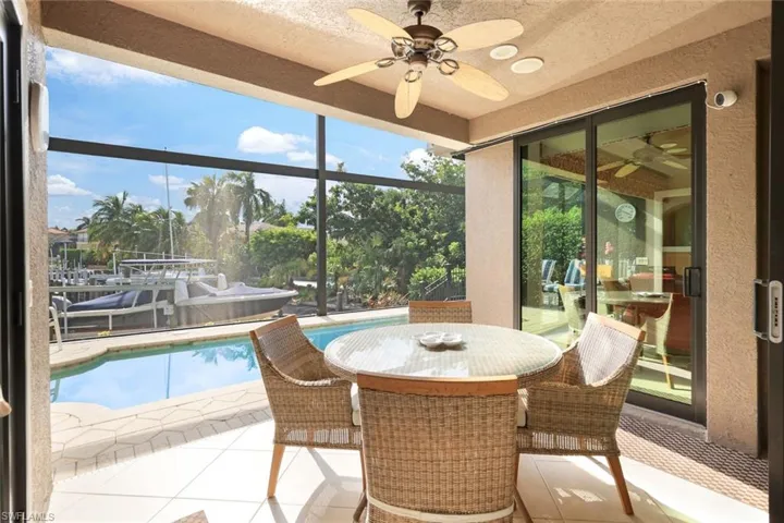 Sunroom / solarium with ceiling fan and a wealth of natural light