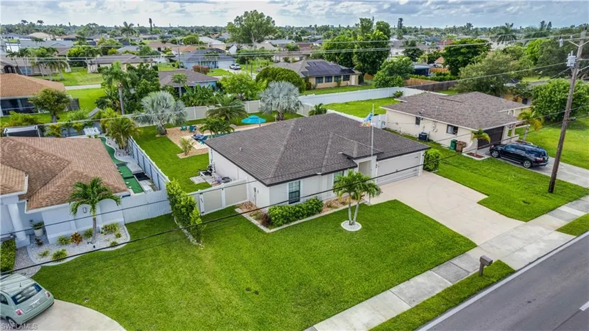Aerial overview of property's location featuring nearby suburban area and a large body of water
