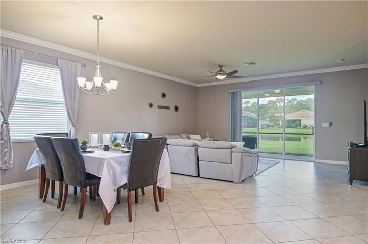 Open floor plan with dining and living room overlooking lake