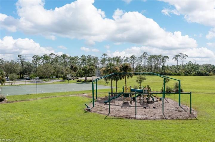 Play area with basketball and plenty of space to fly a kite or kick a ball