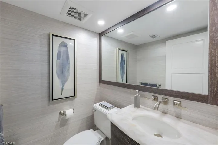 Half bathroom near the laundry room on the first level.
