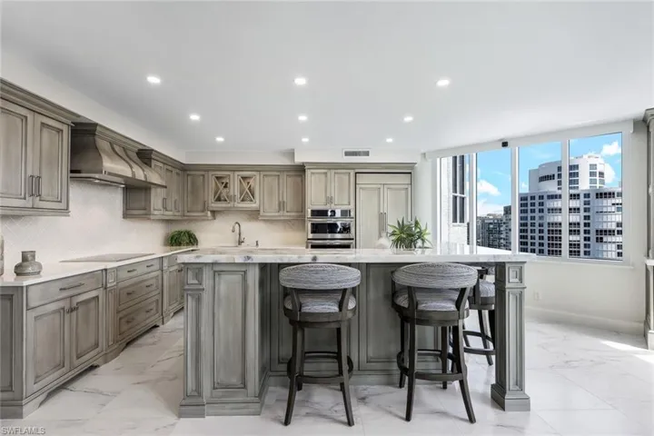 Beautiful custom kitchen with Jenn-Air appliances and seating for 4