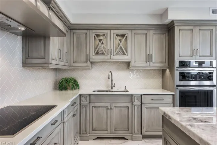 The kitchen has a cooktop, wall oven and wall microwave