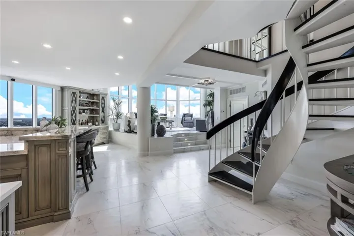 Spiral staircase to the 2nd level and main area on the first level.