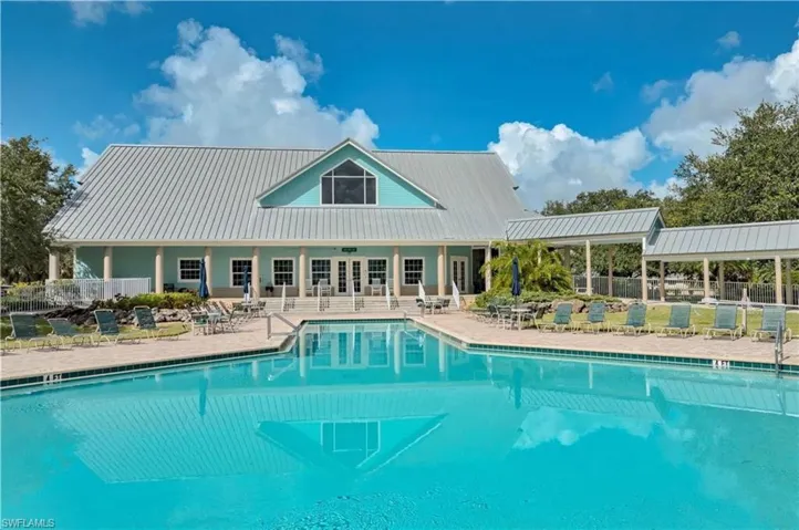 Community pool with a patio