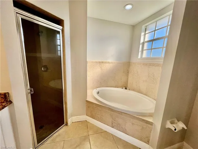 Garden tub and walk in shower.