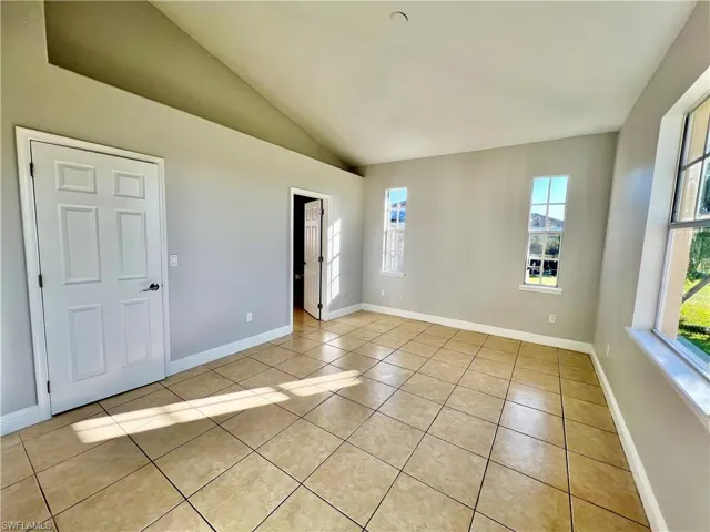Primary bedroom with walk in closet and ensuite private bathroom.