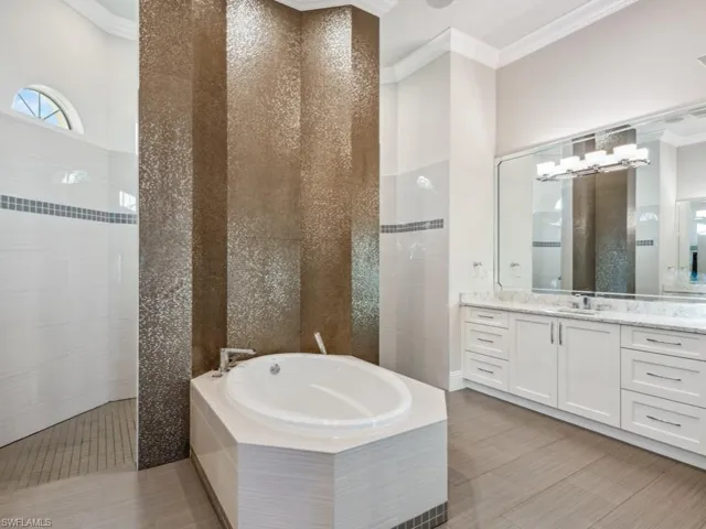 Split granite countertop vanities in bedroom