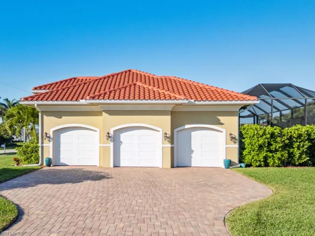Large paver driveway with 3-car garage
