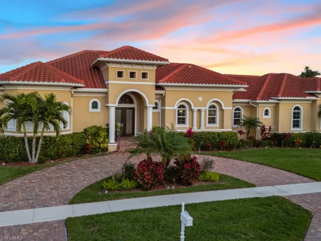 Large semi-circular paver driveway at front
