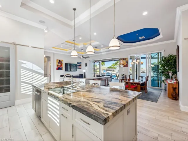 Beautiful fusion granite kitchen island, blue savoy quartz perimeter countertops!