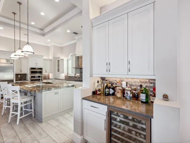 Conveniently located bar with beveragecooler for easy entertaining