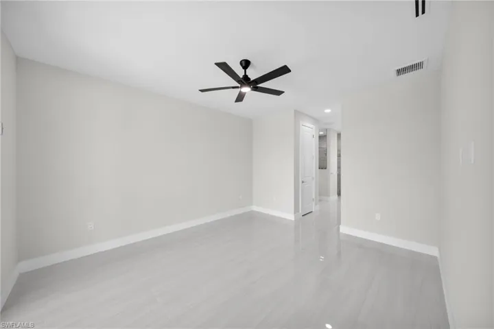 Empty room featuring recessed lighting and ceiling fan