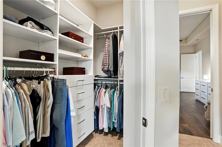 Spacious closet with light wood-style floors