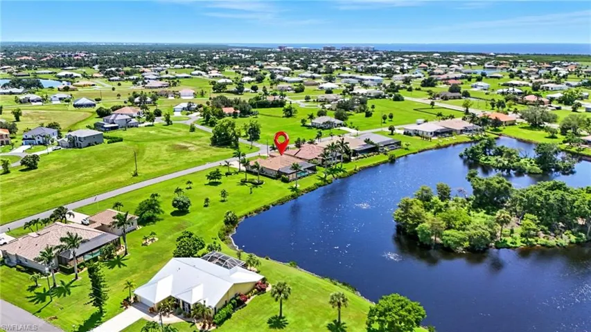 Aerial view of residential area with a large body of water