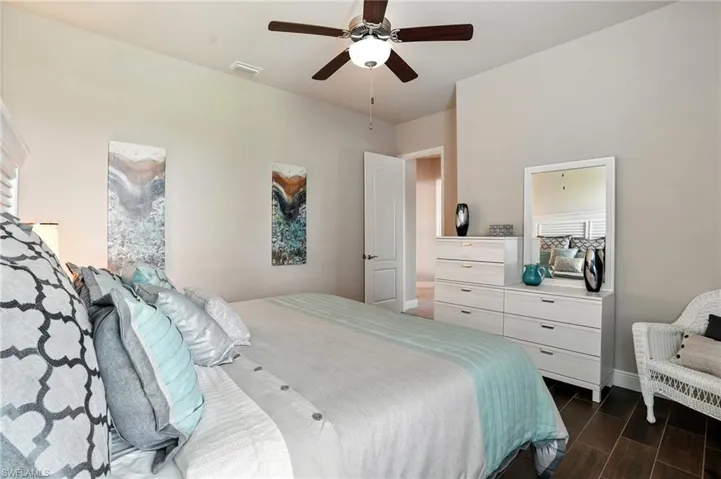 Bedroom featuring wood finish floors and ceiling fan