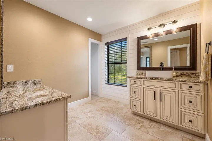 Bathroom with vanity and recessed lighting