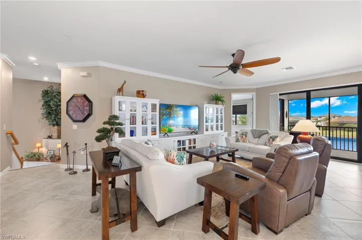 Spacious, open area adjoined by kitchen and dining room.