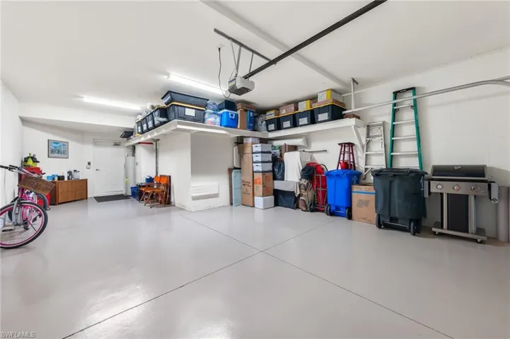 Two-car garage with golf cart space.  Includes utility sink.