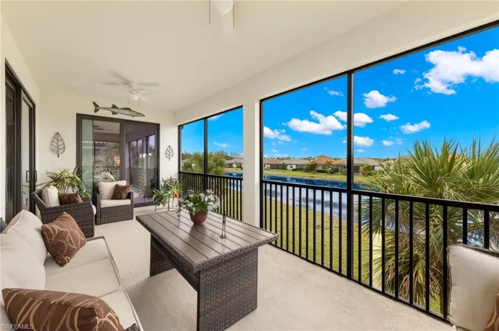 Screened lanai features custom outdoor shade with hold downs.
