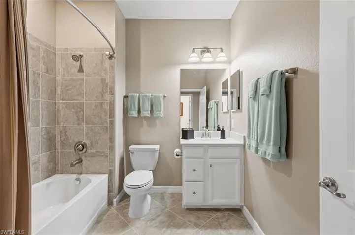This bathroom is shared by bedrooms 2 and 3 and entire section can be closed off with pocket-door for guest privacy.