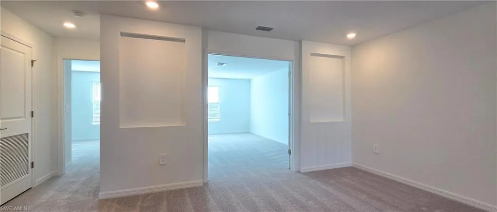 Hall featuring carpet floors and recessed lighting
