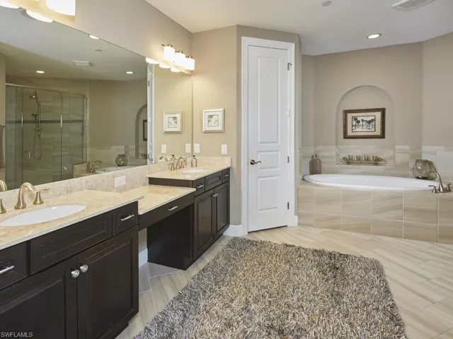 Bathroom with vanity and independent shower and bath
