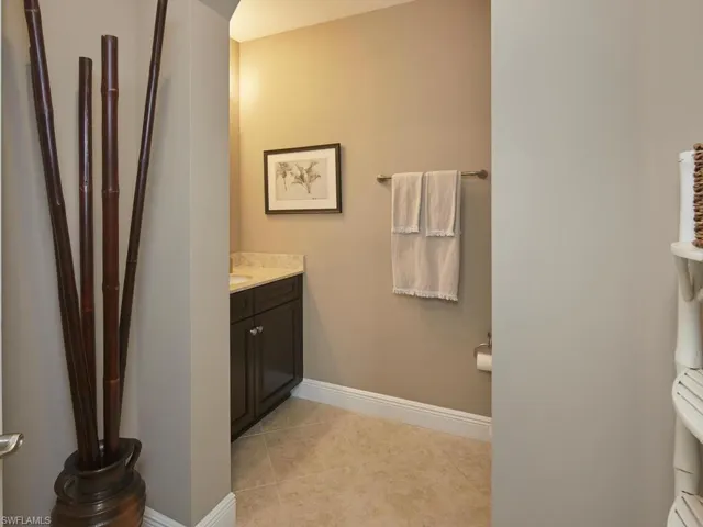 Bathroom with tile patterned flooring and vanity