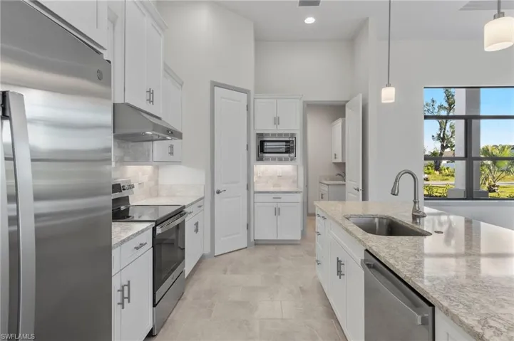 Built in microwave cabinet. With large walk in pantry.