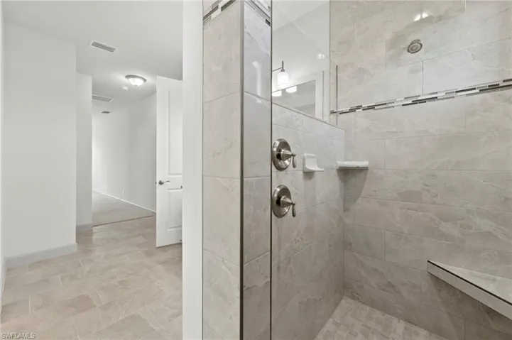 Master bath with 2 shower heads 1 is rain head.
