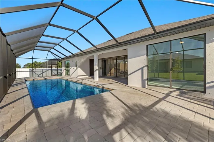 Paver pool deck runs full 62' of home