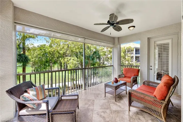 Sunroom / solarium featuring ceiling fan, outdoor lounge area, and a balcony