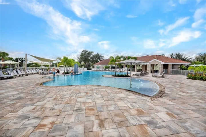 Community pool featuring a patio area