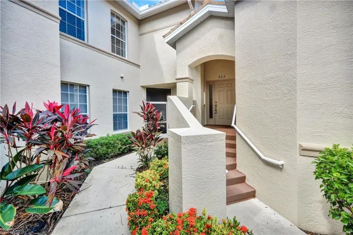 Doorway to property with stucco siding