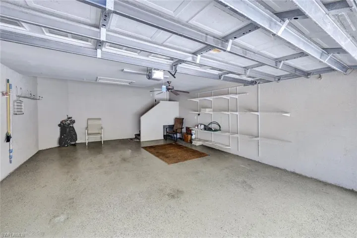 Garage featuring a garage door opener