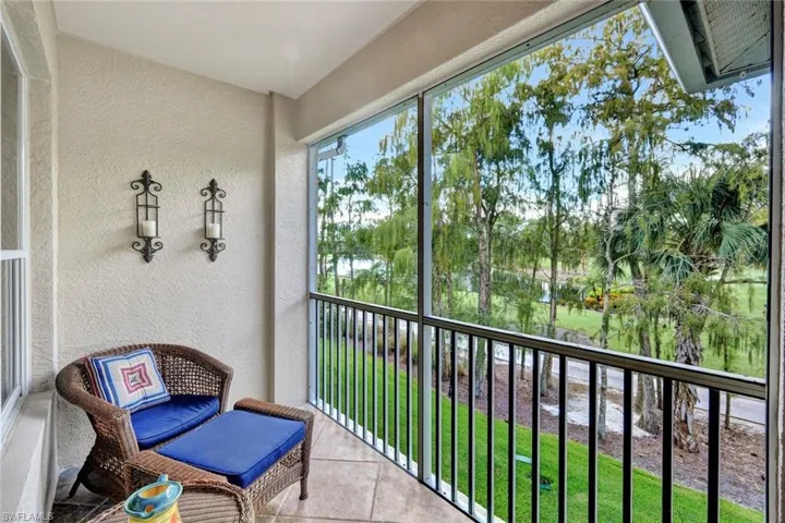 Balcony featuring a sunroom