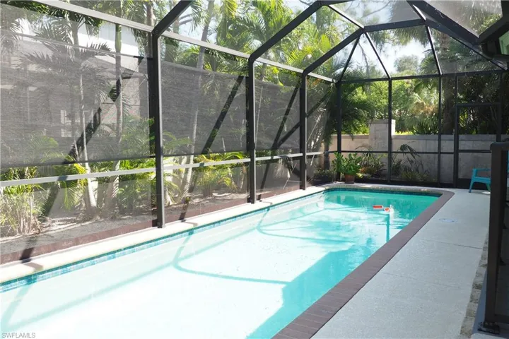 View of pool with a lanai