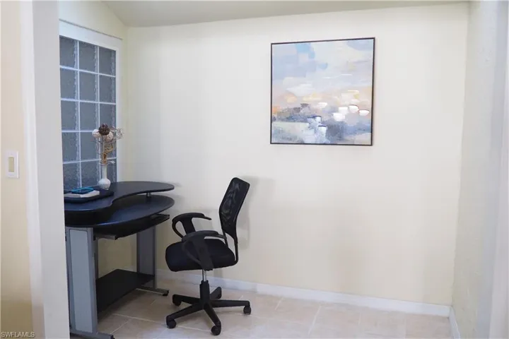 Office area with light tile patterned flooring