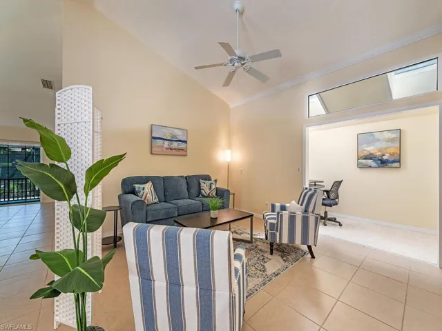 Ceramic tile den area featuring plenty of natural light, high vaulted ceiling.  This area could easily be converted to a 3rd bedroom with a small office area.