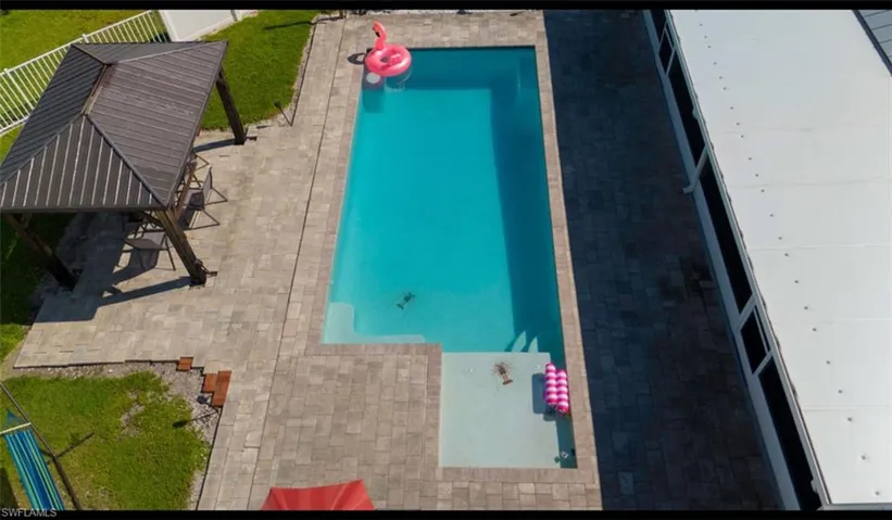 View of swimming pool featuring a gazebo