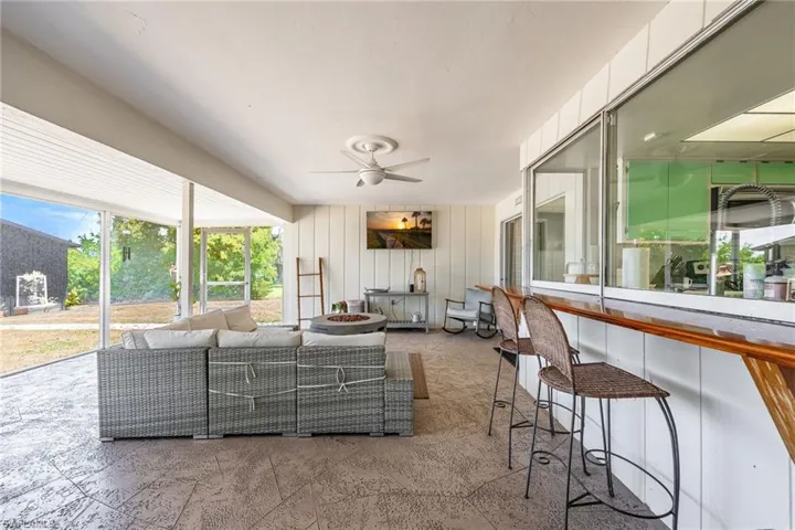 Living area featuring ceiling fan