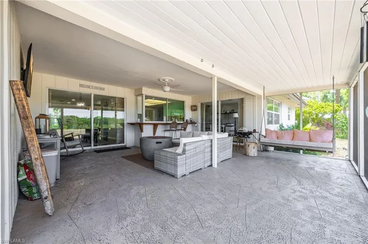 Sunroom / solarium with an outdoor hangout area and a ceiling fan