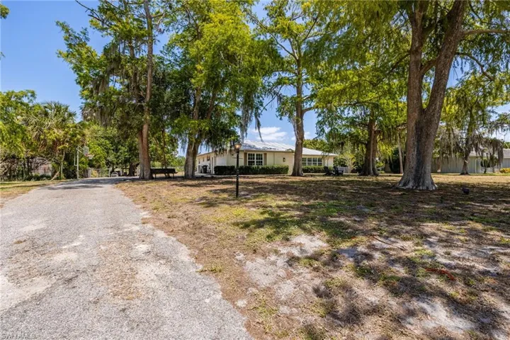 Ranch-style house with gravel driveway